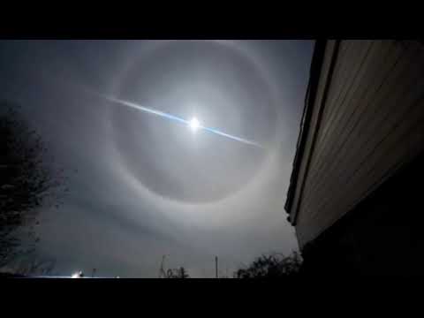 Celestial Spectacle Graces Night Sky: Enchanting Moon Halo Captivates Onlookers